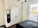 Bedroom features a fan, closet, window, and bed at 4438 Encore Park Xing, Duluth, GA 30097