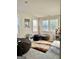 Bright bonus room with multiple windows, carpet, a games display shelf, and room for many beanbag chairs at 4438 Encore Park Xing, Duluth, GA 30097
