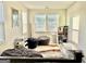 Bright bonus room with multiple windows, carpet, a games display shelf, and room for many beanbag chairs at 4438 Encore Park Xing, Duluth, GA 30097