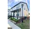 Charming two-story home featuring a covered porch and a well-maintained, landscaped front yard at 4438 Encore Park Xing, Duluth, GA 30097