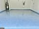 Spacious two-car garage featuring a newly painted floor and ample space at 4438 Encore Park Xing, Duluth, GA 30097