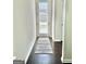 Hallway featuring wood floors, neutral walls, and a door to the outside at 4438 Encore Park Xing, Duluth, GA 30097