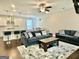 Open floorplan showcasing the living room with adjacent kitchen, featuring modern decor and a seamless flow at 4438 Encore Park Xing, Duluth, GA 30097