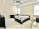 Spacious primary bedroom with a ceiling fan and natural light from a window at 4438 Encore Park Xing, Duluth, GA 30097