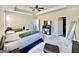 Spacious primary bedroom with a ceiling fan and natural light from windows at 4438 Encore Park Xing, Duluth, GA 30097