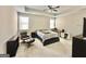 Spacious primary bedroom with a ceiling fan and natural light from a window at 4438 Encore Park Xing, Duluth, GA 30097