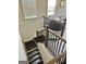 Staircase featuring dark wood floors and a banister at 4438 Encore Park Xing, Duluth, GA 30097