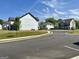 Street view showcasing new homes in a planned residential community with lush green spaces at 4438 Encore Park Xing, Duluth, GA 30097