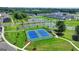 Community tennis courts provide a recreational space with surrounding green lawns and a nearby pond at 4438 Encore Park Xing, Duluth, GA 30097