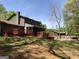 Rear exterior view of the home featuring a large deck and swimming pool at 275 Summertown Dr, Stockbridge, GA 30281