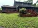 Large backyard with deck, patio, and stairs leading to lush lawn at 275 Summertown Dr, Stockbridge, GA 30281