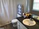Cozy bathroom featuring modern fixtures, a toilet, and stylish black countertop, perfect for a quick refresh at 275 Summertown Dr, Stockbridge, GA 30281