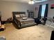 Bedroom with a bed, ceiling fan, and carpet flooring at 275 Summertown Dr, Stockbridge, GA 30281