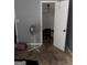 Simple bedroom with open closet space and fan, practical and utilitarian space at 275 Summertown Dr, Stockbridge, GA 30281