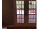 View from inside a home leading to backyard deck with a pool at 275 Summertown Dr, Stockbridge, GA 30281