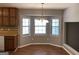 Bright dining area with bay windows, pendant lighting, and wood floors at 275 Summertown Dr, Stockbridge, GA 30281