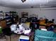 Cluttered garage area with versatile storage solutions, ideal for projects and organization at 275 Summertown Dr, Stockbridge, GA 30281