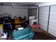 Cluttered garage with a ride on lawnmower and plenty of extra storage space at 275 Summertown Dr, Stockbridge, GA 30281