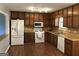 Efficient kitchen featuring wood cabinetry, modern appliances, and ample counter space at 275 Summertown Dr, Stockbridge, GA 30281