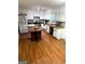 Bright kitchen with white cabinets, laminate floors, and butcher block countertops at 275 Summertown Dr, Stockbridge, GA 30281
