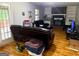 Spacious living room with hardwood floors, fireplace, and large glass doors at 275 Summertown Dr, Stockbridge, GA 30281