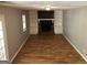 Inviting living room with wood floors, cozy fireplace, and built-in shelving at 275 Summertown Dr, Stockbridge, GA 30281
