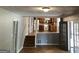 Bright, open living room with hardwood floors, stairs and a view into the modern kitchen at 275 Summertown Dr, Stockbridge, GA 30281