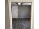 Gray room showcases laminate floors and a door to an adjacent room at 275 Summertown Dr, Stockbridge, GA 30281