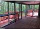 Spacious screened porch overlooking a deck area and backyard at 275 Summertown Dr, Stockbridge, GA 30281
