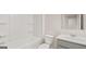 A well-lit bathroom featuring a toilet, vanity, and shower-tub combination at 334 Sound Cir, Stockbridge, GA 30281