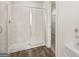 Bathroom with tiled shower and vinyl floor at 334 Sound Cir, Stockbridge, GA 30281