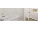Close up of soaking tub and shower with view through the doorway to window at 334 Sound Cir, Stockbridge, GA 30281