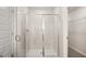Bathroom featuring glass shower with tile surround and vinyl floor at 334 Sound Cir, Stockbridge, GA 30281