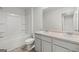 Bathroom with a dual sink vanity and a tub-shower combination at 334 Sound Cir, Stockbridge, GA 30281