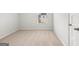 Bedroom featuring a window, neutral carpet, and base trim detail at 334 Sound Cir, Stockbridge, GA 30281