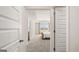 View of the bedroom from the doorway, showcasing neutral tones, plush carpeting, and natural light at 334 Sound Cir, Stockbridge, GA 30281