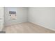 Bedroom featuring a window, neutral carpet, and base trim detail at 334 Sound Cir, Stockbridge, GA 30281