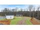 Scenic community area showcases a gazebo and path winding through landscaped grounds surrounded by lush, mature trees at 334 Sound Cir, Stockbridge, GA 30281