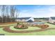Aerial view of a community area showcases a playground and gazebo with walking paths for enjoying the outdoors at 334 Sound Cir, Stockbridge, GA 30281