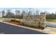 Stone community entrance sign for Echo Glen surrounded by meticulously maintained landscaping at 334 Sound Cir, Stockbridge, GA 30281