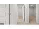 Hallway featuring neutral carpet and white doors at 334 Sound Cir, Stockbridge, GA 30281