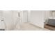 Upstairs hallway with carpet, railing and access to the bathroom at 334 Sound Cir, Stockbridge, GA 30281