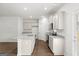 Open kitchen showcasing granite countertops, stainless steel appliances, and hardwood floors at 334 Sound Cir, Stockbridge, GA 30281