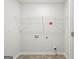 Laundry room featuring tile floor and wire shelving at 334 Sound Cir, Stockbridge, GA 30281