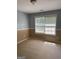 Bright bedroom with a chair rail and a large window offering ample natural light at 117 Rendition Dr, Mcdonough, GA 30253