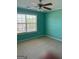 Bedroom showcasing a bright window and fan lighting with a neutral carpet at 117 Rendition Dr, Mcdonough, GA 30253