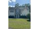 Traditional two-story home with stone accents, blue shutters, and a well-manicured lawn at 117 Rendition Dr, Mcdonough, GA 30253