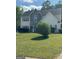 Charming two-story home with stone accents, blue shutters and a landscaped yard at 117 Rendition Dr, Mcdonough, GA 30253