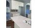 Bright kitchen with island, white cabinets, and a tile backsplash at 117 Rendition Dr, Mcdonough, GA 30253