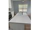 Spacious kitchen with an island sink, and modern gas range cooktop at 117 Rendition Dr, Mcdonough, GA 30253